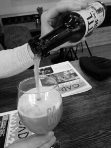 Pouring Roblipa beer in a glass